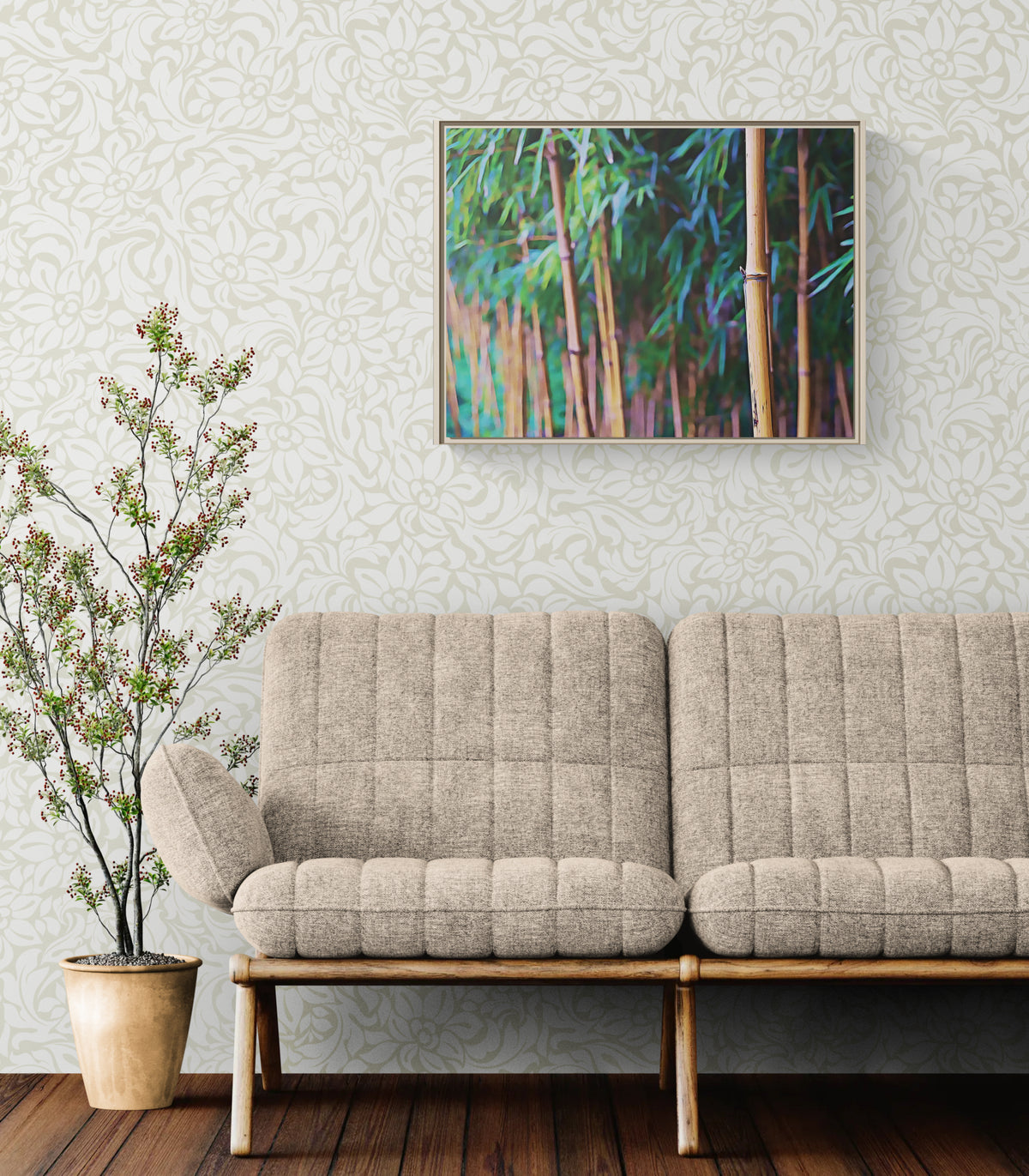 A framed art print depicting a green bamboo forest hangs on a patterned wallpaper wall above a beige tufted sofa. A potted plant stands on the floor to the left.