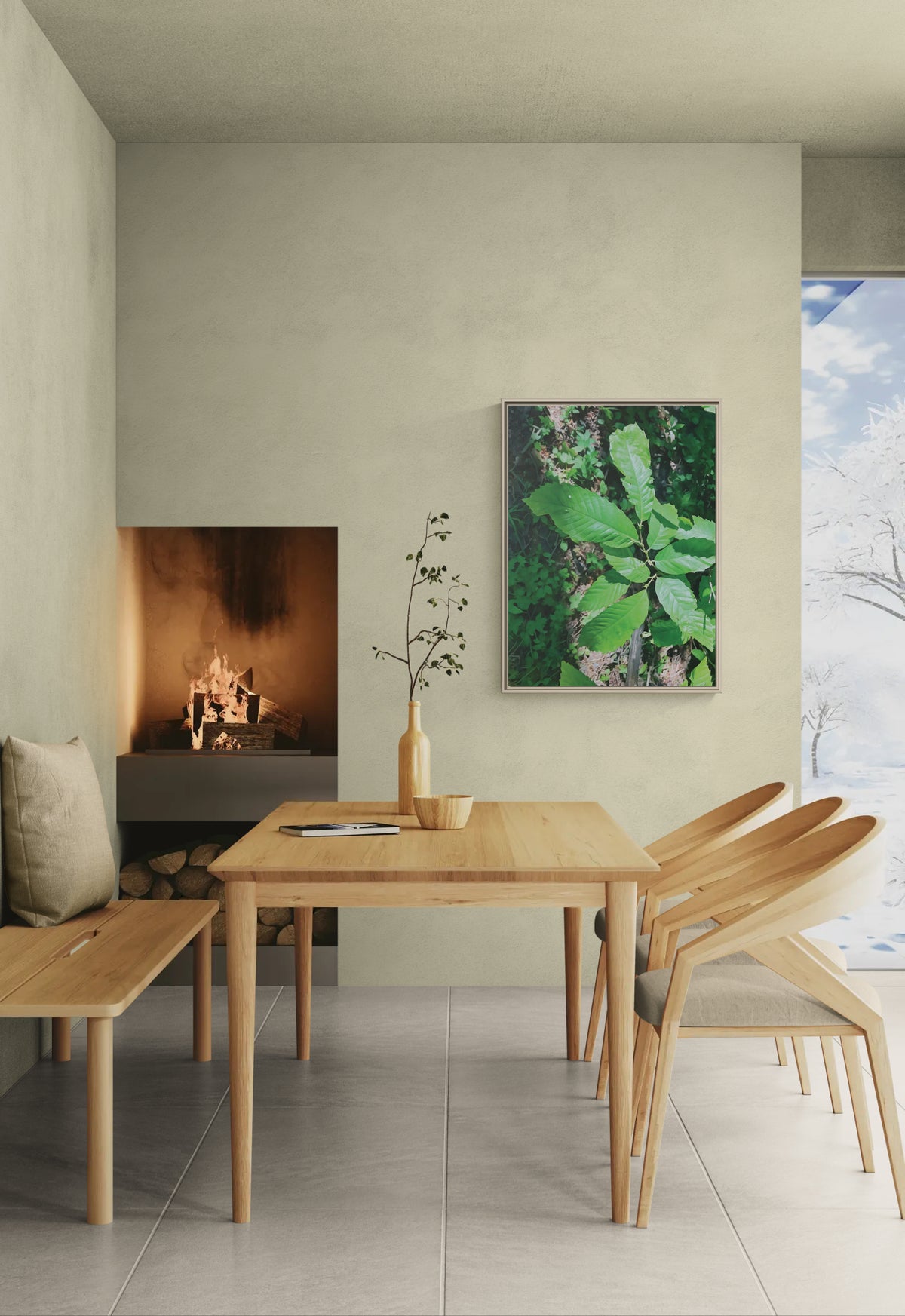 Dining room with wooden table and chairs near a fireplace and framed leaf wall art