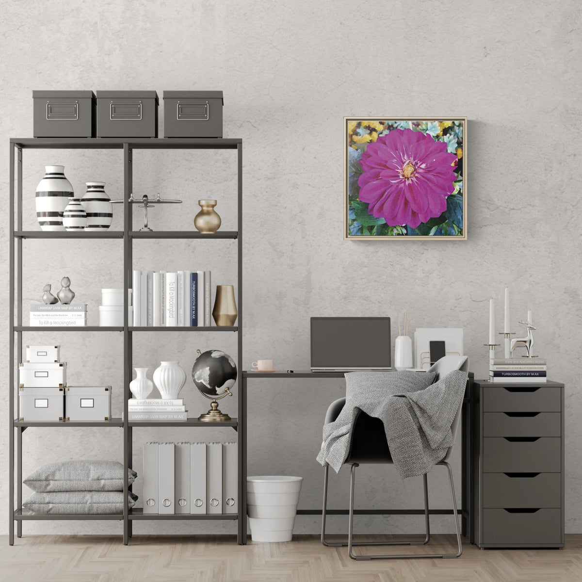 Home office with a desk, shelving unit, and a framed floral wall art print featuring a large purple dahlia