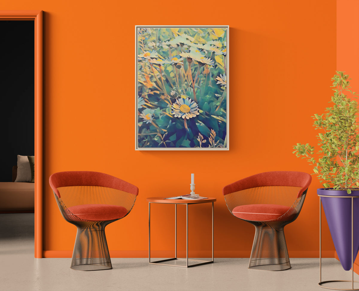 Abstract daisy wall art hanging on an orange wall between two wire frame chairs and a small table