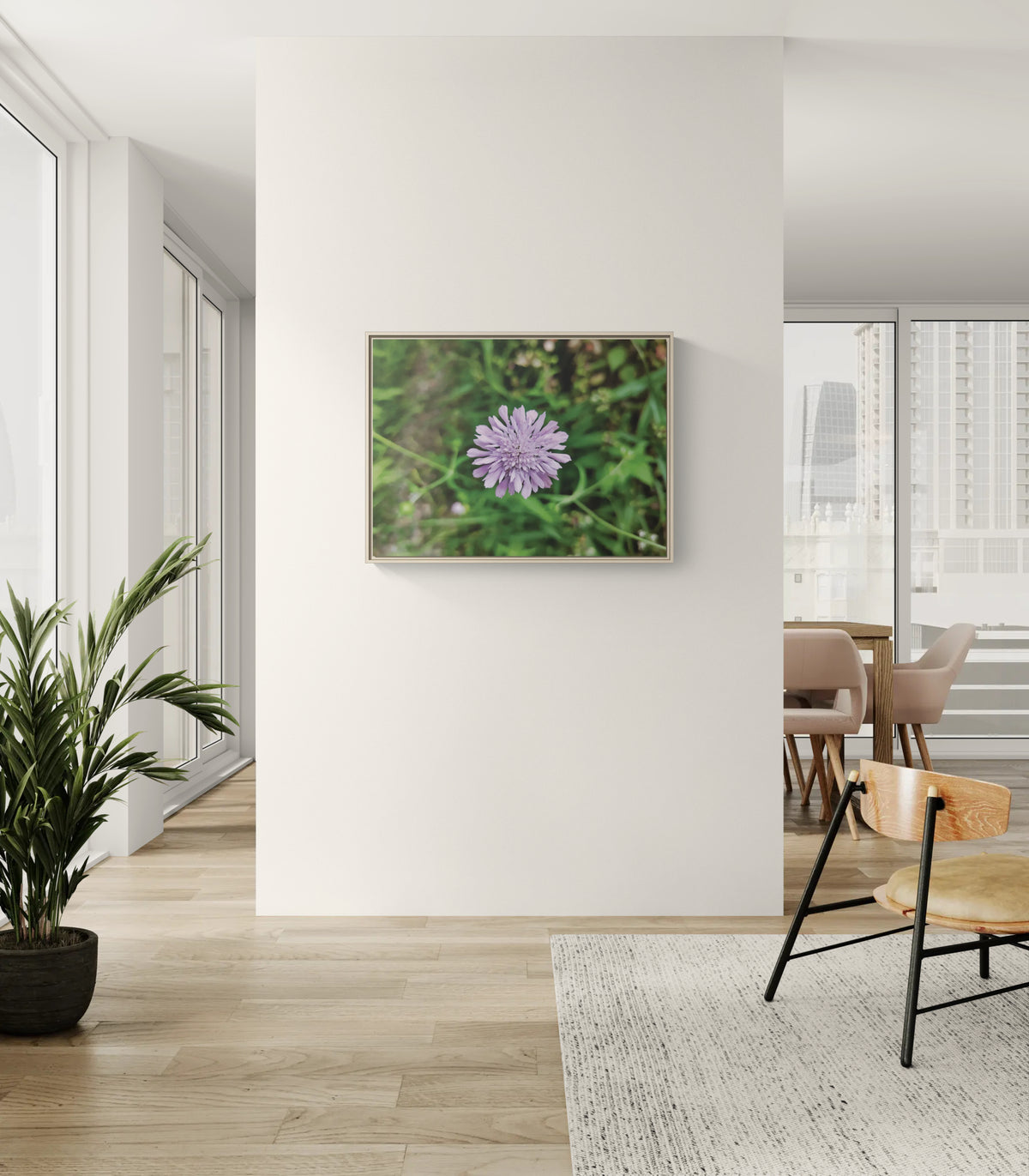 Framed wall art featuring a purple flower in a modern living room
