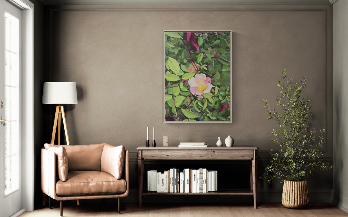 Framed floral wall art hanging above a wooden console table in a living room