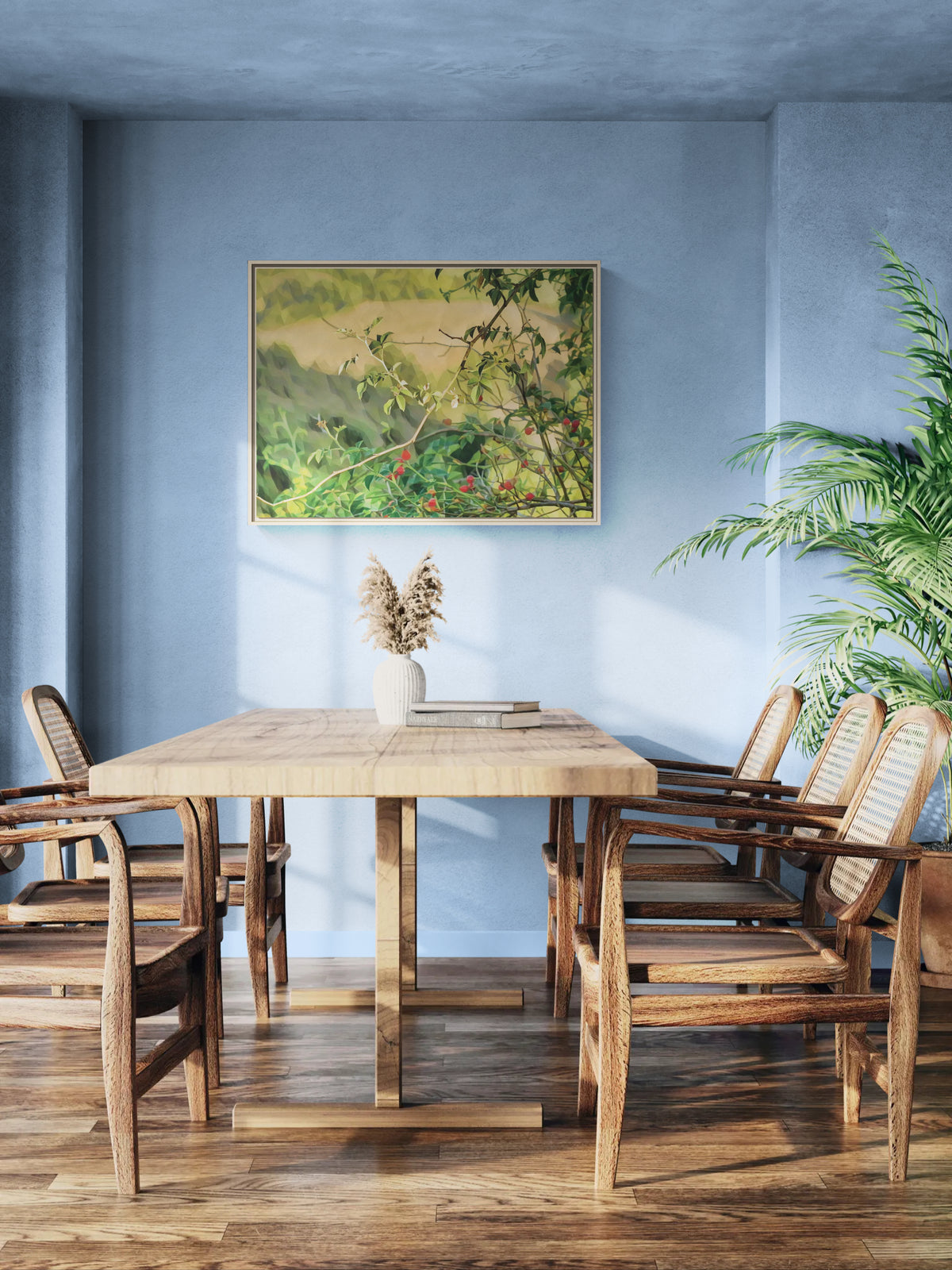 Dining room with wooden table and cane chairs against a blue wall with landscape art